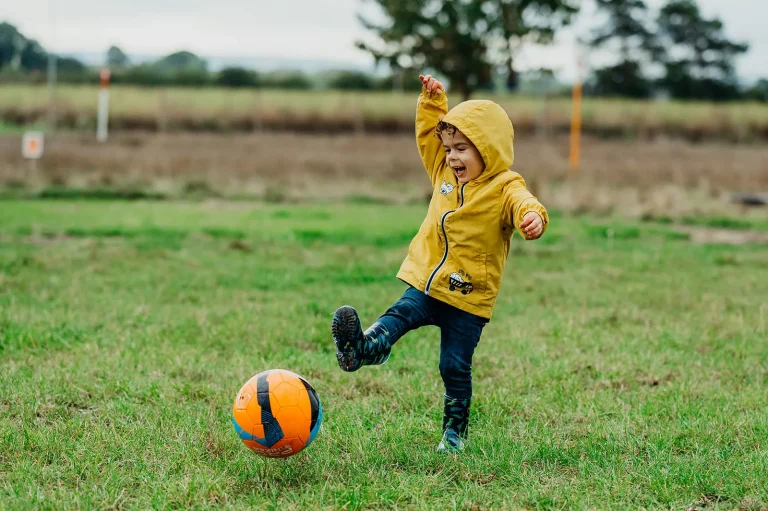 Boy playing football/footgolf