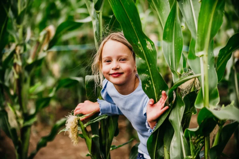 Girl peeking out from Maize Maze