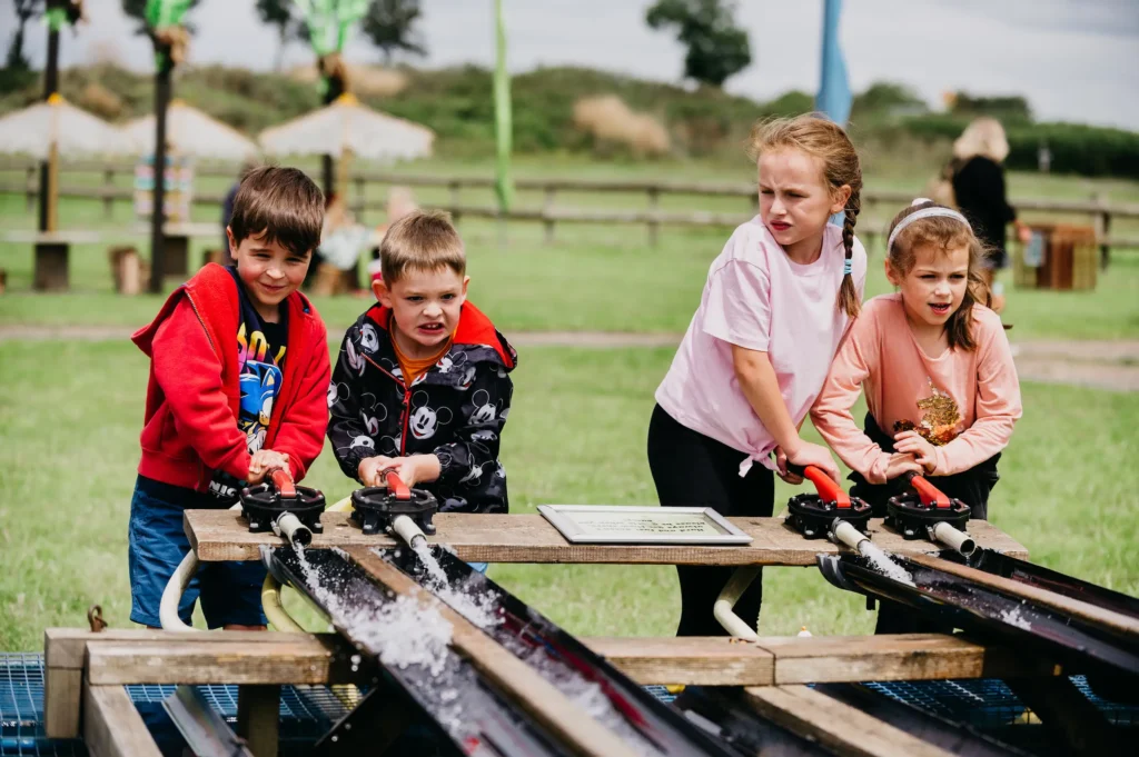 Kids on duck water racing