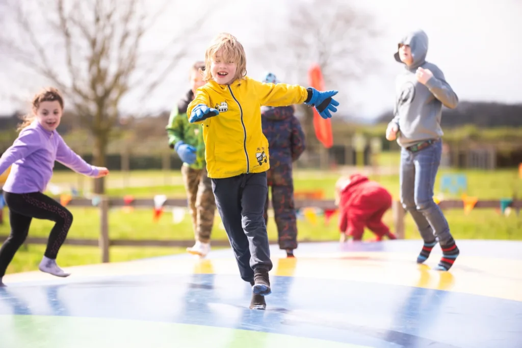Kids on bouncy pillows having fun