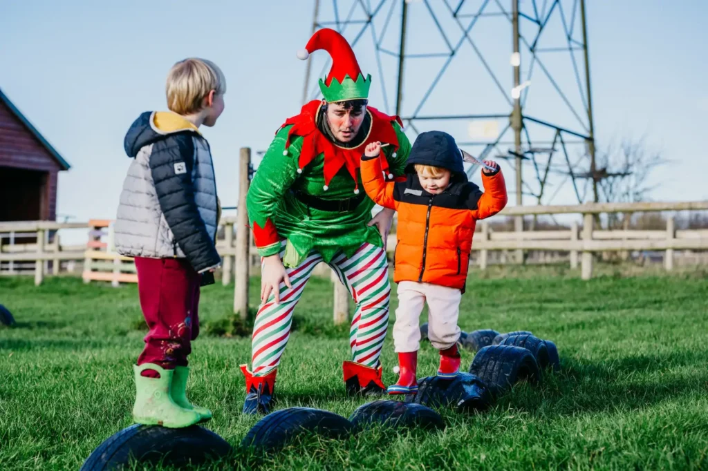 Kids on scrapyard play area with Elf in Countryside Adventure image 2
