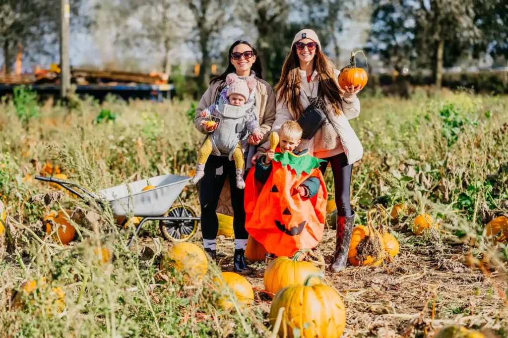 Mum with kids in the pumpkin patch